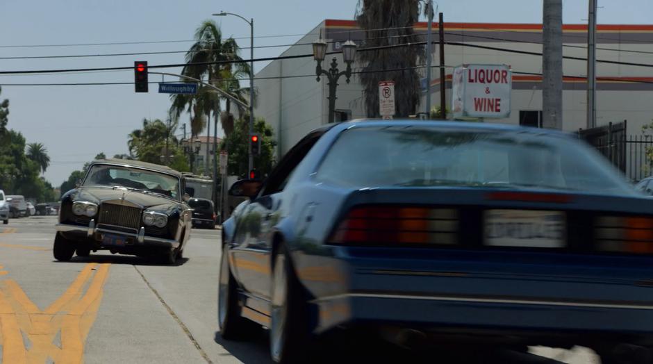 Chase briefly swerves the car into oncoming traffic after taking the corner too fast.