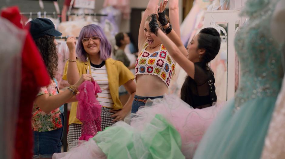 Gert, Karolina, and Nico cheer Molly after she finds her dress.