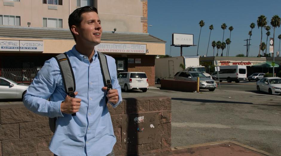 Vaughn watches as the car approaches to pick him up.