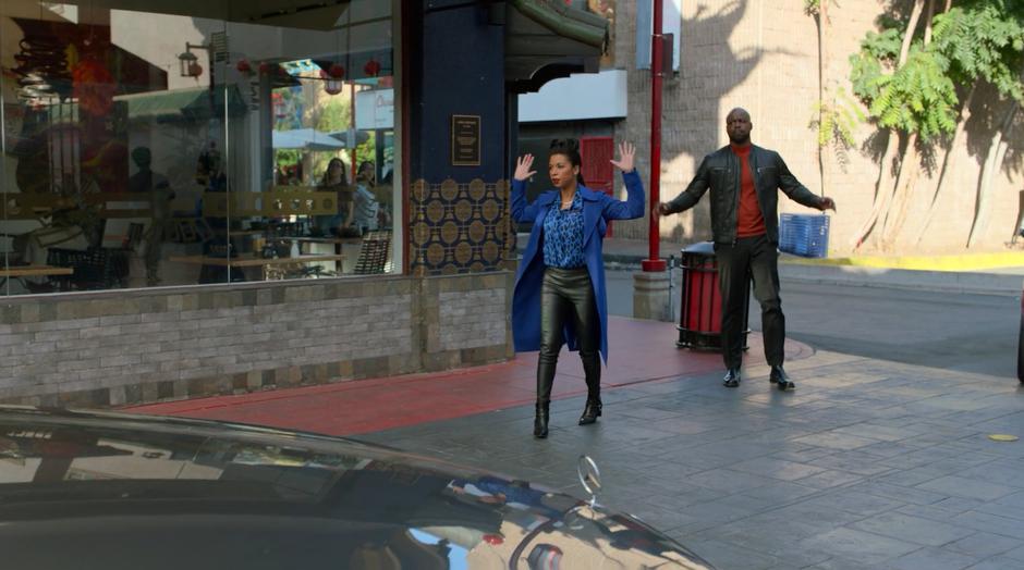 Catherine and Geoffrey put their hands up when the police arrive.