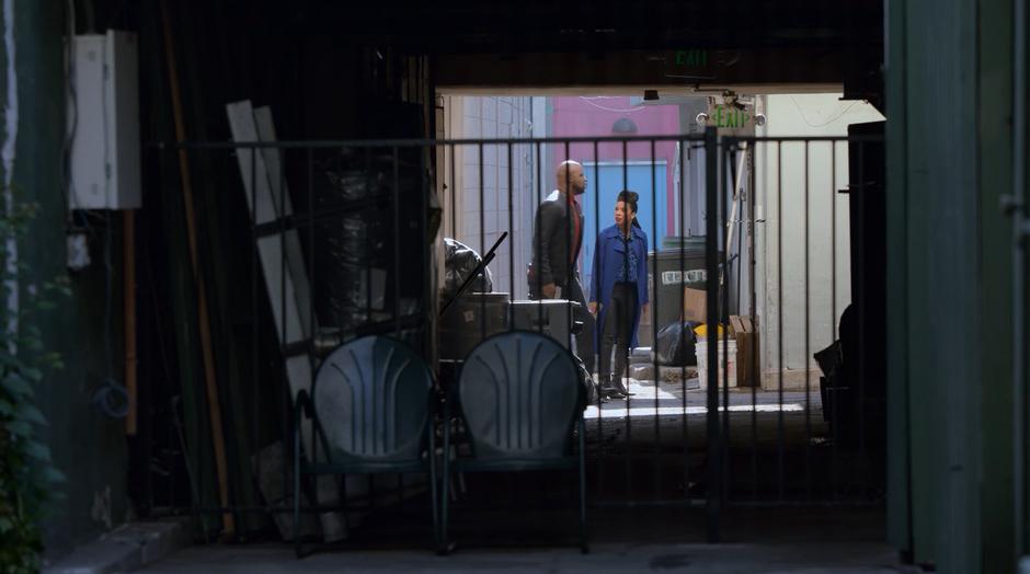 Geoffrey and Catherine start heading out of the alley after hearing a gunshot.