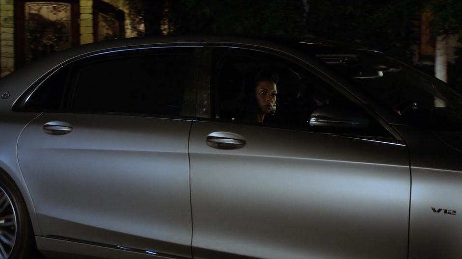 Catherine and Geoffrey step out of their car after arriving at the house.