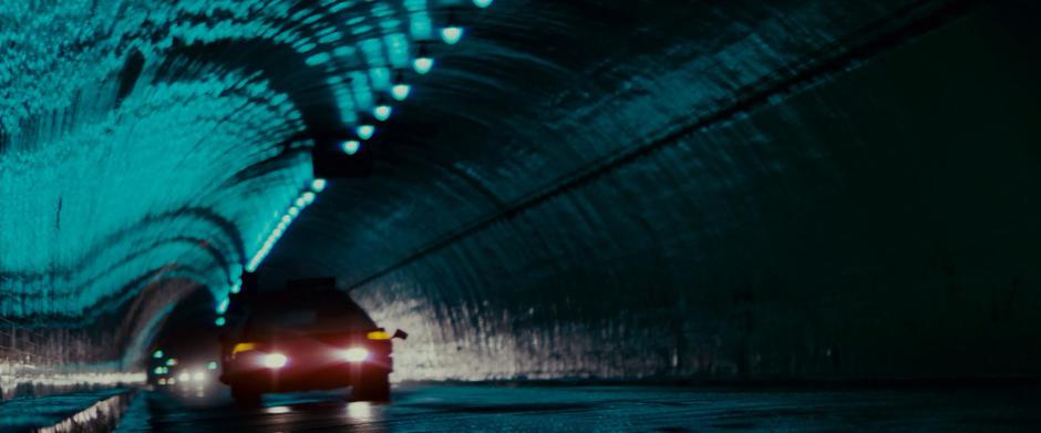 Deckard's car drives down the shiny tunnel.
