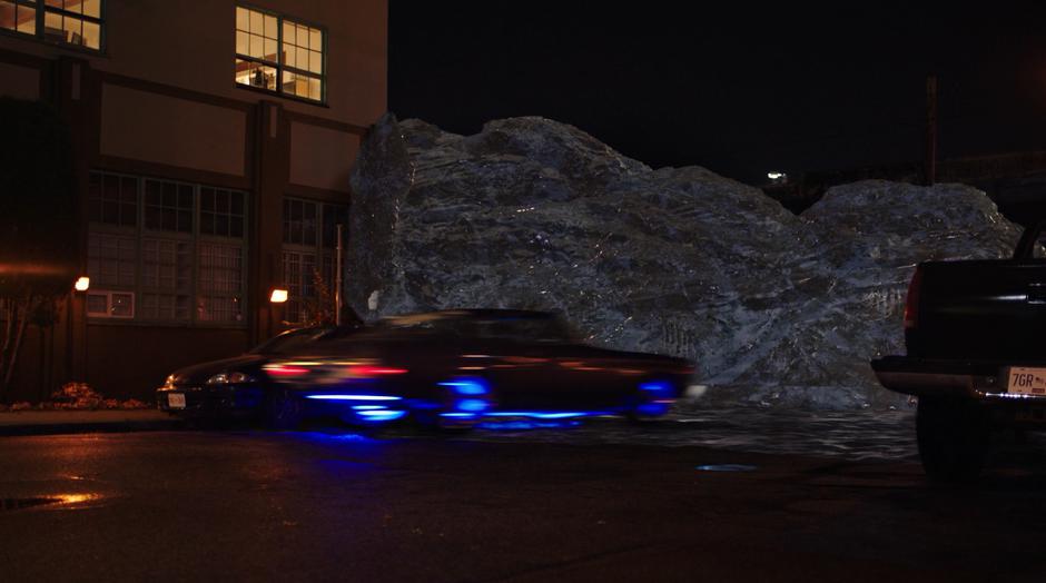 The stealth car phases as it approaches the ice wall.