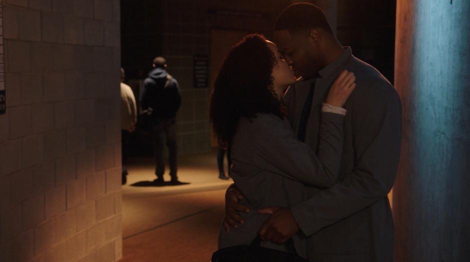 Macy kisses Galvin and pushes him against the wall.