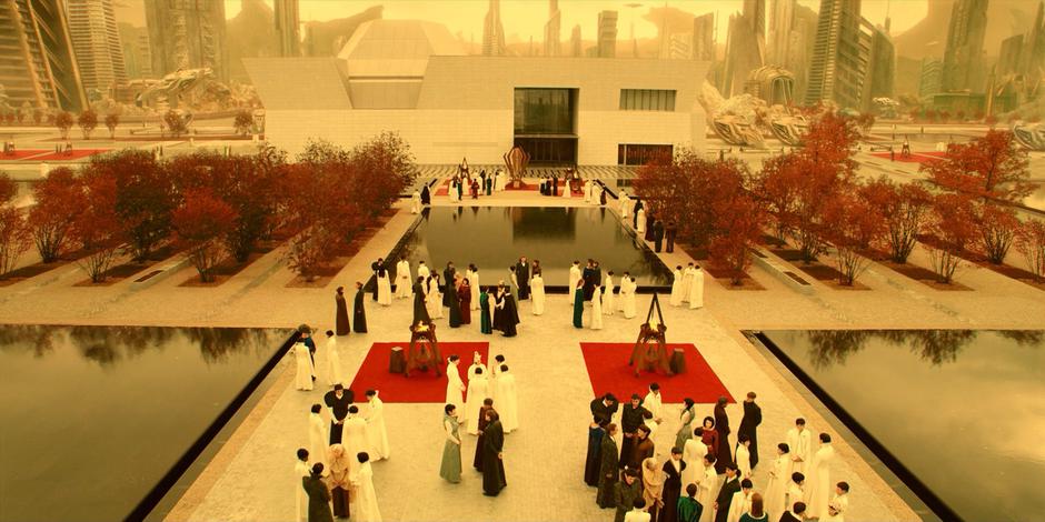 People mill around the fountains during the graduation party.