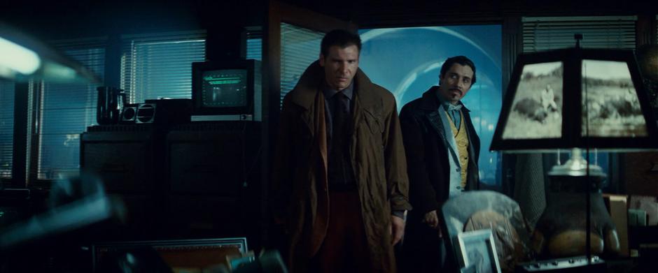 Deckard and Gaff enter Bryant's office.