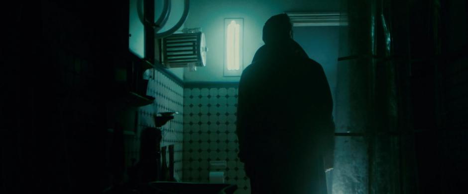 Deckard searches around inside the bathroom.