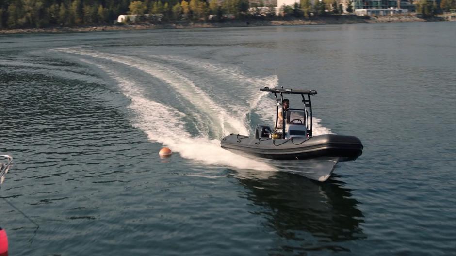 Ben drives his boat back to the dock.