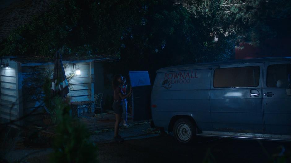 Maddie and Ryn prepare the van to transport the mermaids.