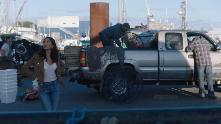 Nicole Martinez looks up at Xander's boat from the dock.