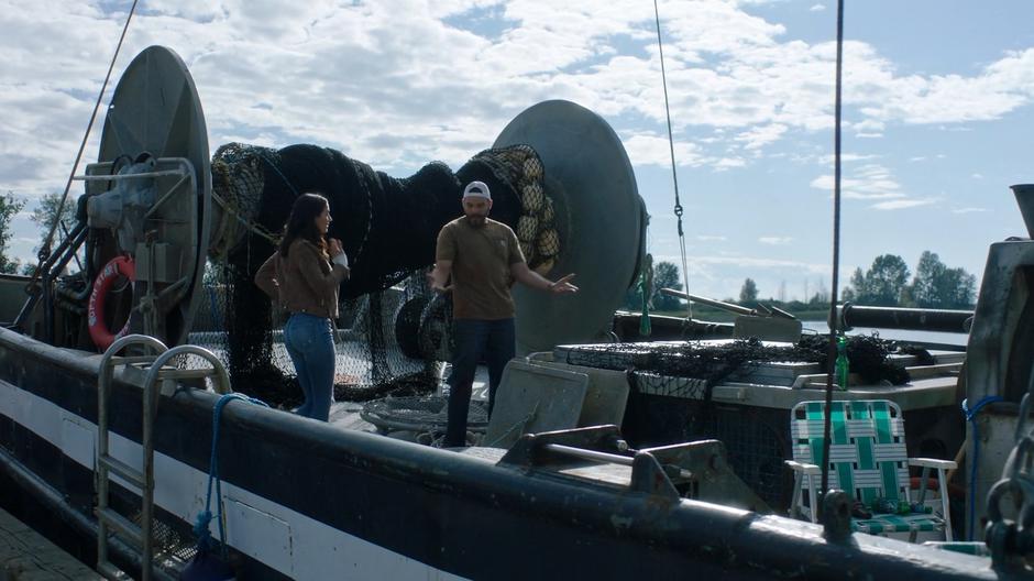 Xander shows off his boat to Nicole Martinez.