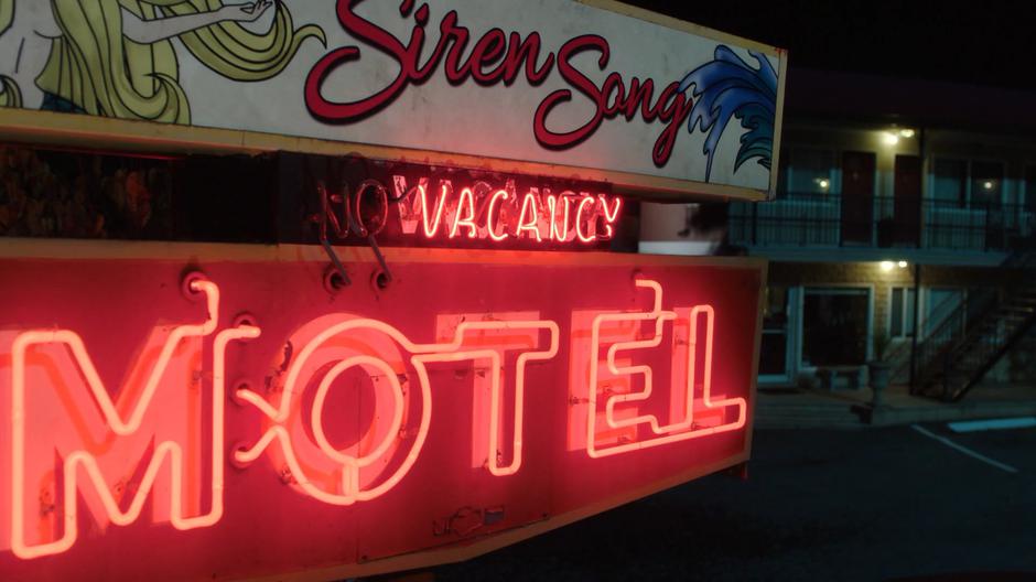Establishing shot of the motel sign.