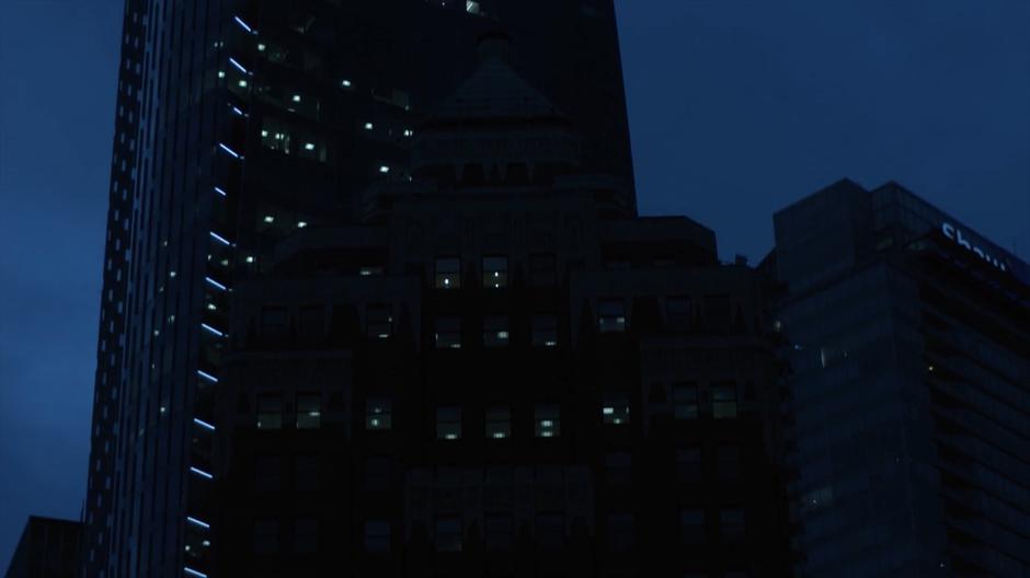 Nighttime establishing shot of Marina's building.