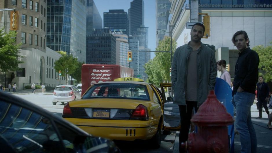 Penny and Quentin look down at Frankie as he parks in front of a fire hydrant.