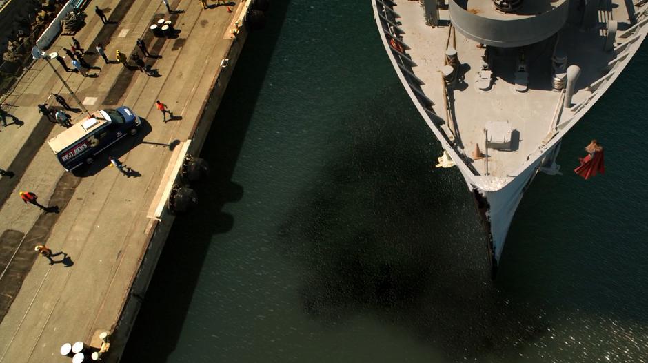 Kara pulls away from the ship as oil starts spilling into the water.