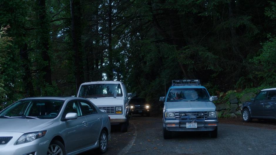 Ben drives down the road towards the bar with Levi.