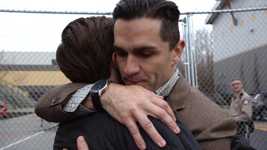 Ben Lockwood hugs his son just outside the prison gate.