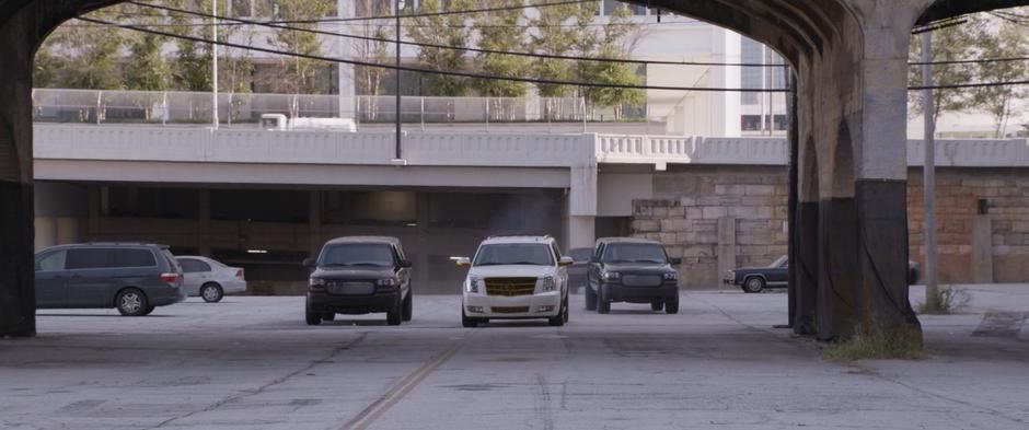 Sonny Burch's goons drive through the lot towards the lab.