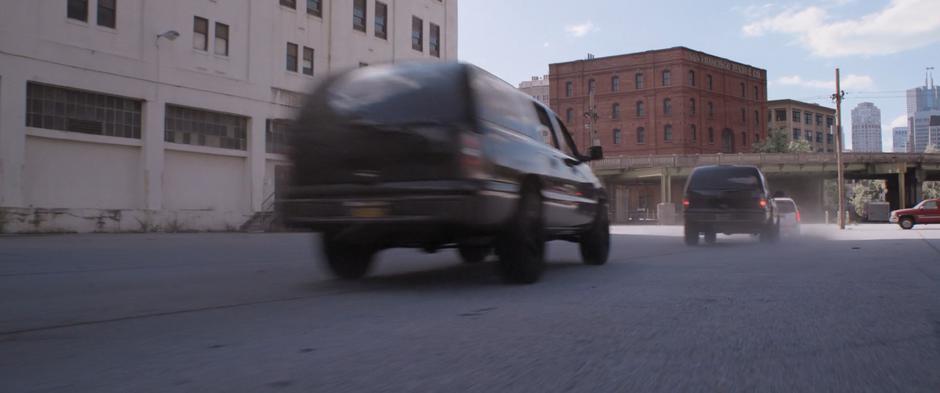 Sonny Burch's goons follow the van out of the lot.