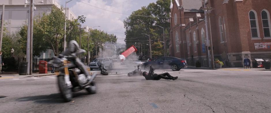 Ghost dodges out of the way as the motorcyclist falls to the ground after barely dodging the Pez Dispenser.