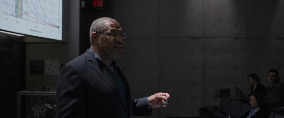 Bill Foster dives a lecture in front of a classroom of students.