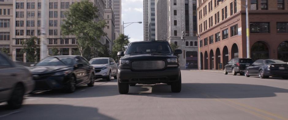 One of Sonny Burch's SUV drives up.