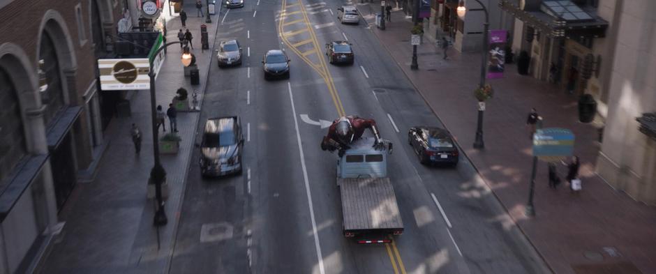 Scott puts his feet on the ground trying to slow down the truck.