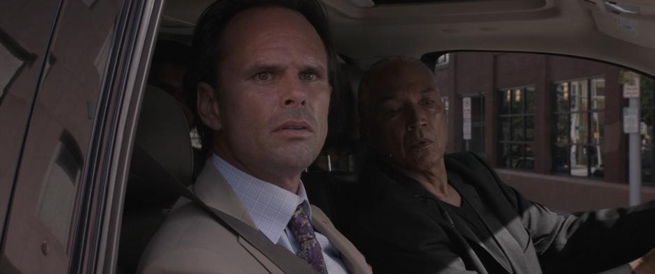 Sonny Burch and one of his goons watches as Ghost steals one of his goons' motorcycles.