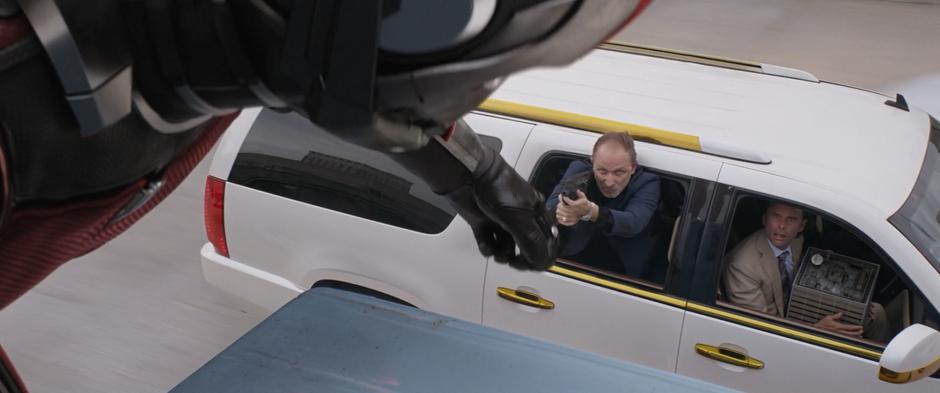 Sonny Burch watches as an enlarged Scott flips the gun out of his goon's hand.