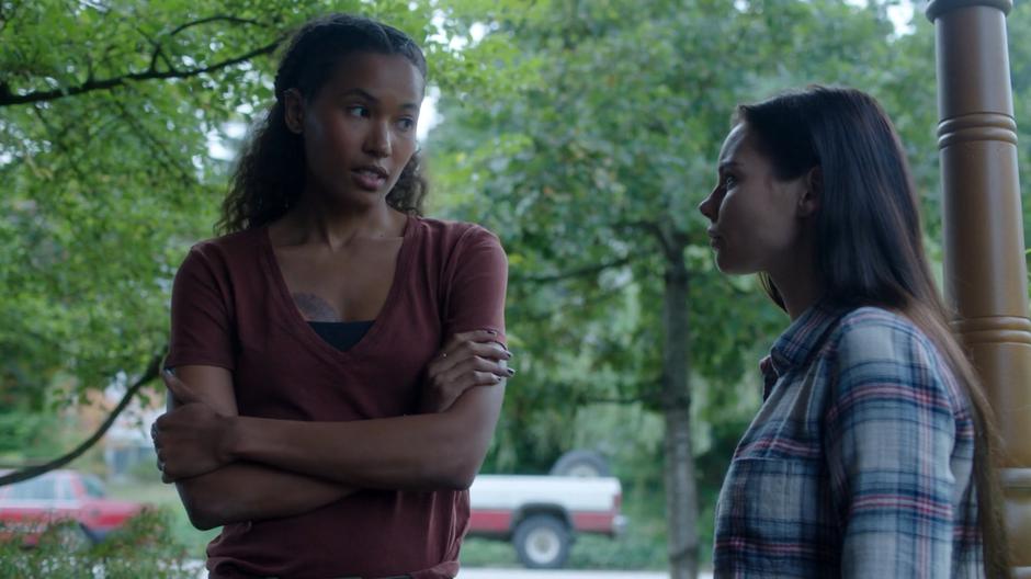 Maddie talks to Ryn on the front porch.