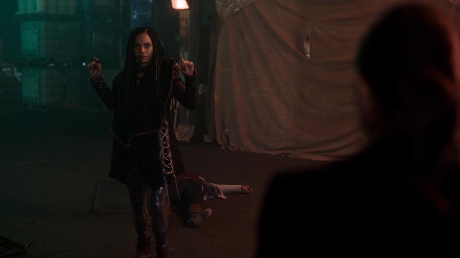 Jada turns around after Mel saved her from being shot by another crossbow bolt.