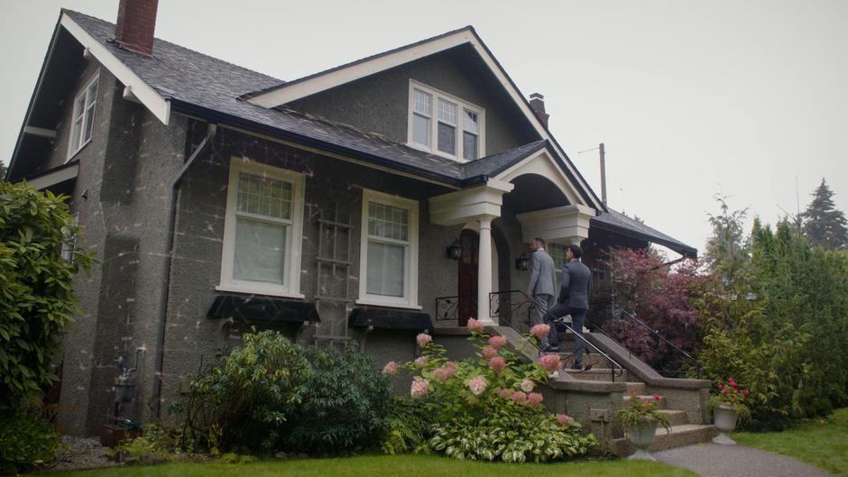 Gavin and Muhammed watch as the house is surrounded by the protection spell.