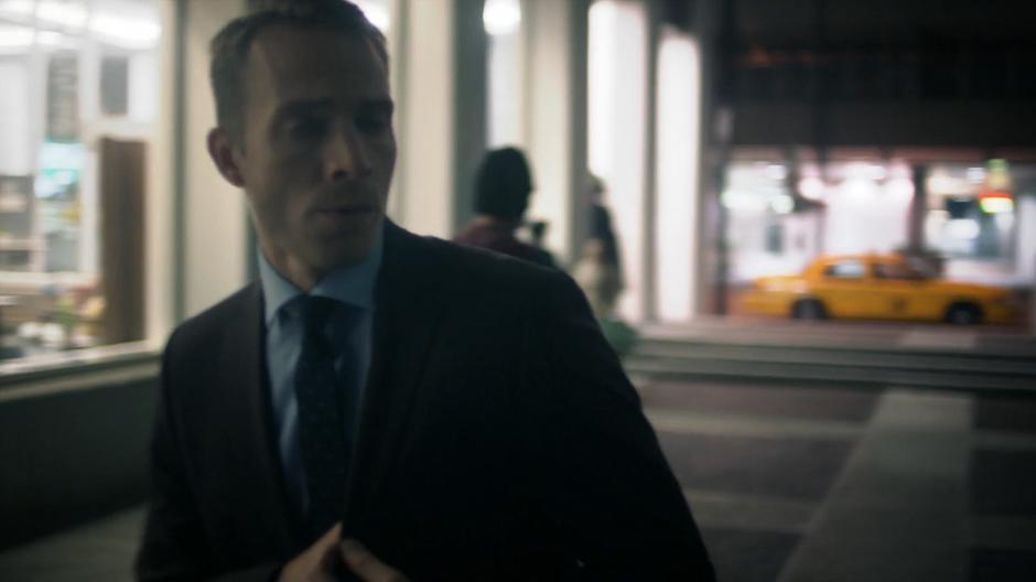 Pete wanders through the plaza at night.