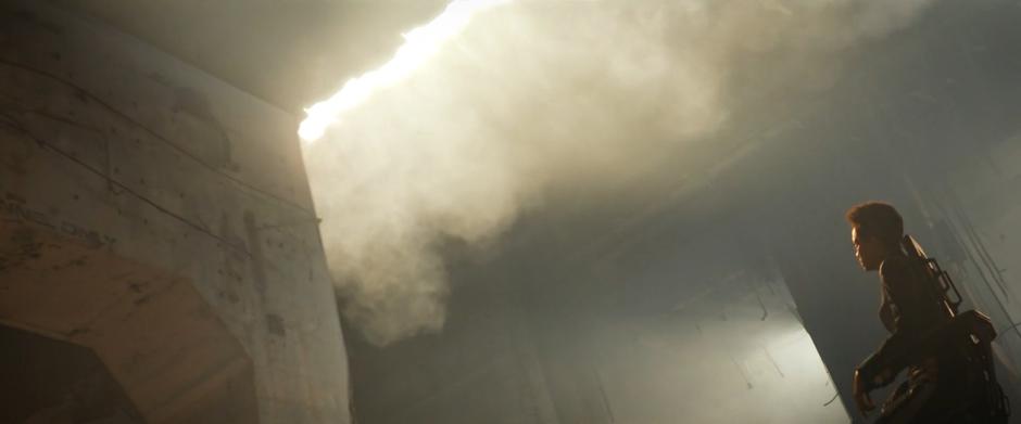 Michael looks up as the ceiling of the facility opens letting in a cloud of toxic dust.