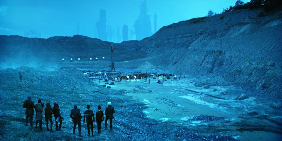 Tyler and Michael stand with the Resistance guards on a ridge looking down at the camp which just appeared.