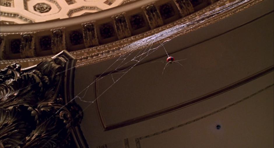 A radioactive spider descends from the lab ceiling.