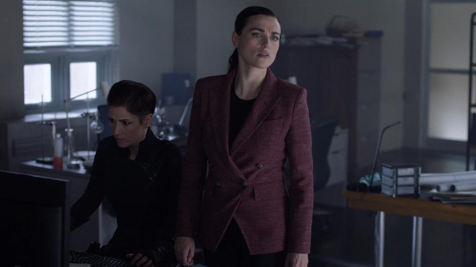 Lena looks over at Kara who is holding up the gun that shot James while Alex searches the computer for answers.