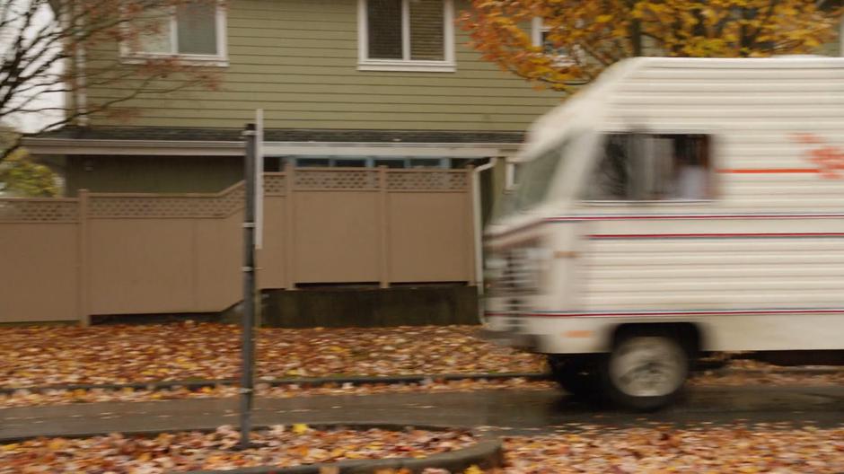 The RV drives down the street driven by Ray.