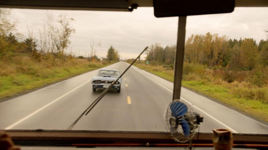 The RV swerves to avoid a car after pulling into the oncoming lane.