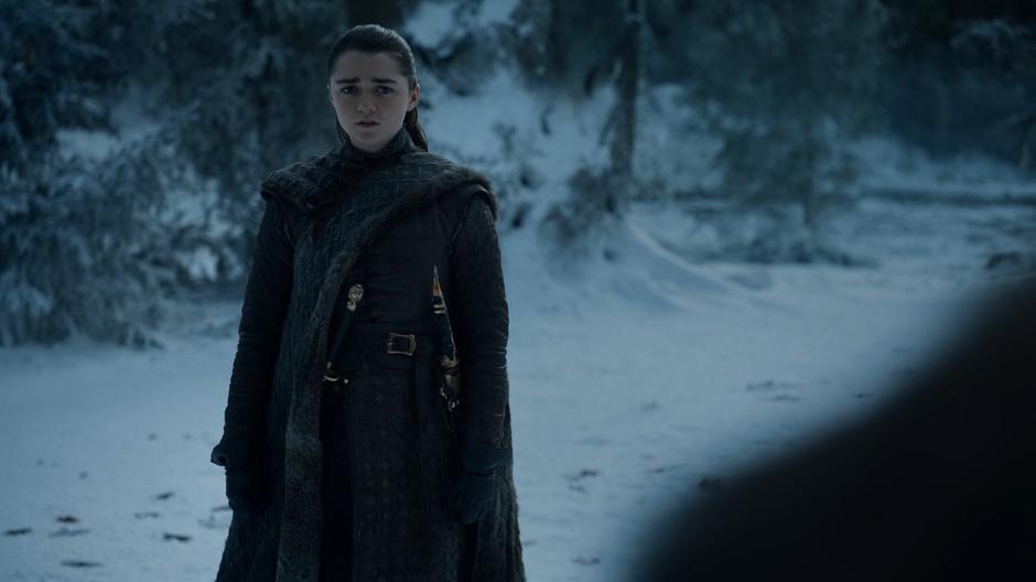 Arya looks over at Jon as he turns around.