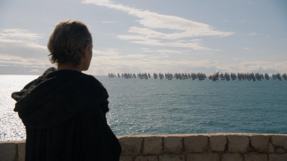 Qyburn looks out at the fleet in the harbour after Cersei leaves.