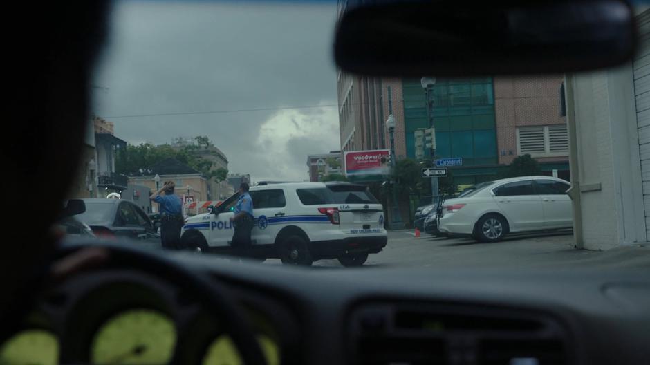 Adina pulls the car to the side of the road as the police search cars passing through the checkpoint.