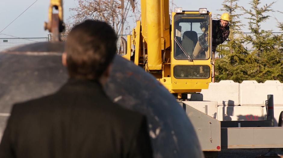 Mr. T pokes his head out of the crane cab to see if Nate is okay.