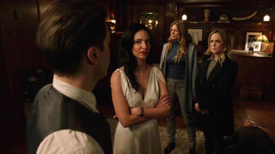 Zari and Sara give Nate odd looks while Ava stands over the body of one of the Nazis.