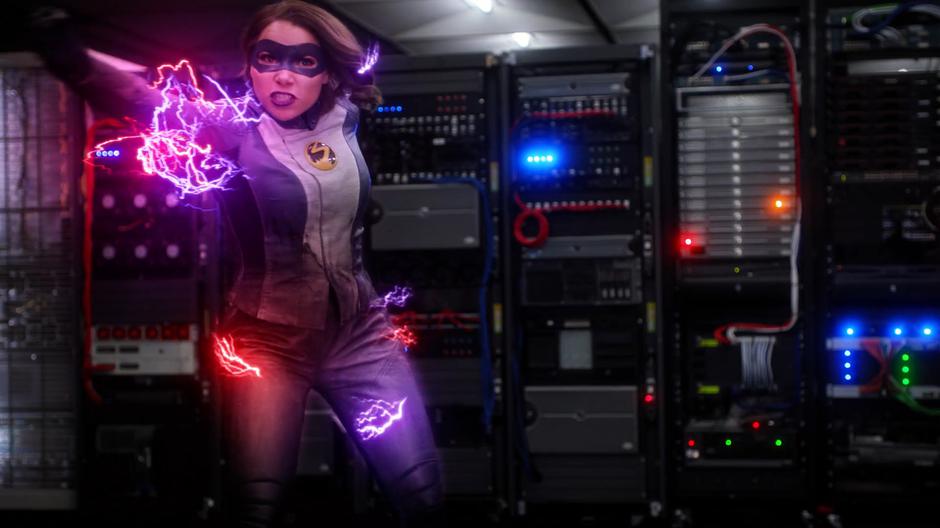 Nora throws a lightning bolt at the server containing the blueprints.