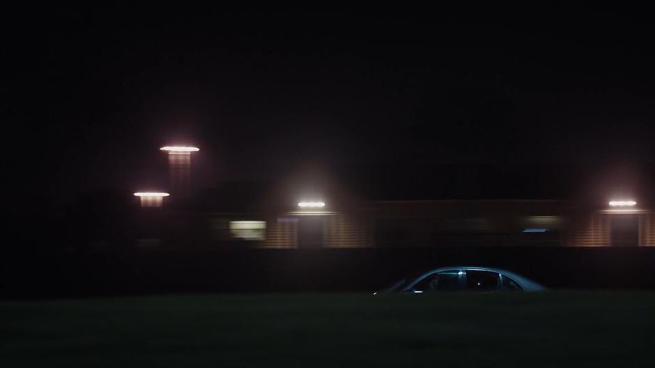 Tyrone and Tandy drive down the dark street in the stolen car.