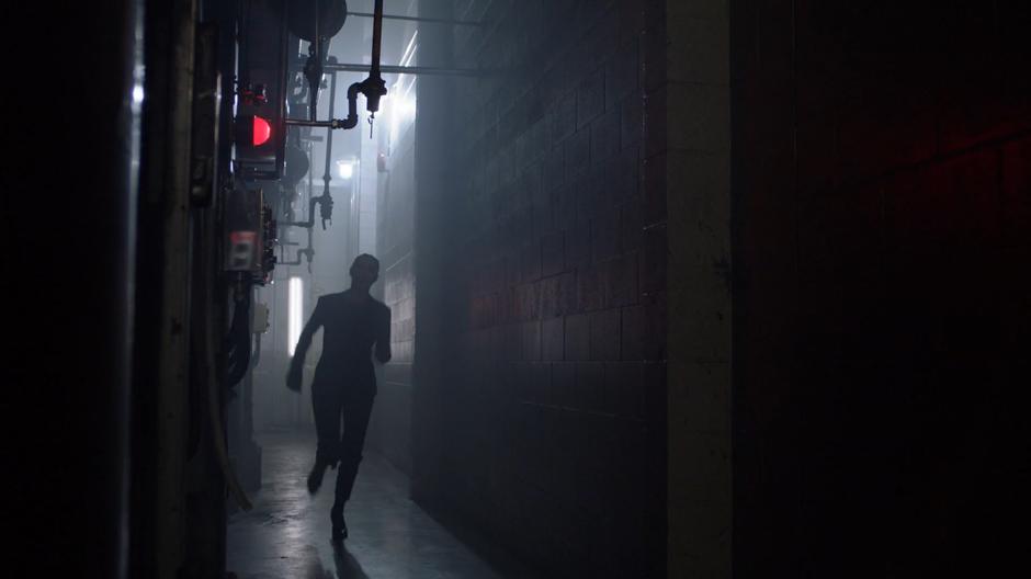 Lena runs down a hallway looking for an exit during the countdown.