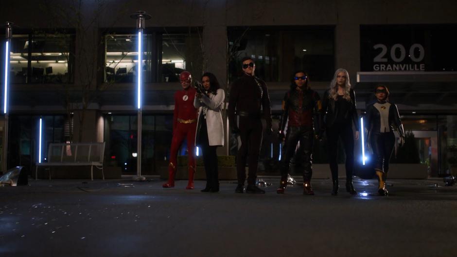 Barry, Iris, Ralph, Cisco, Caitlin, and Nora line up dramatically in front of Thawne.
