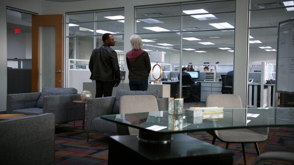 Clive and Liv talk in Melissa Schultz's office while waiting for her to arrive for her interview.